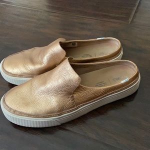 Toms gold slip ons